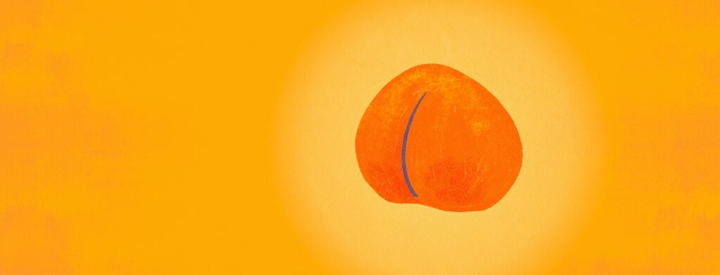 A peach sits alone with a yellow glow surrounding it mimicking the sun.